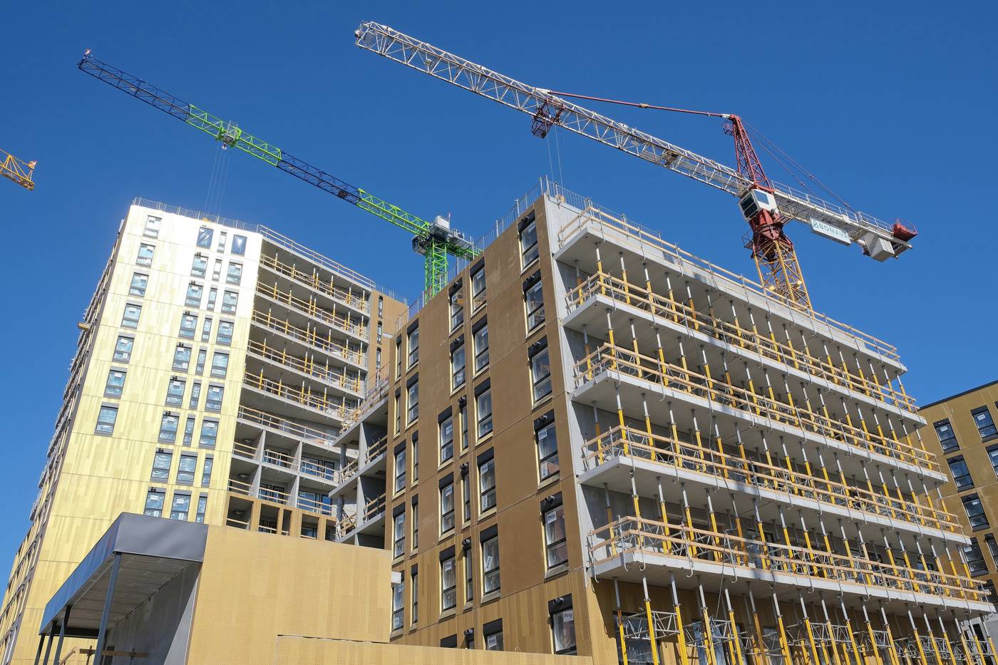 Residential construction site with tower cranes