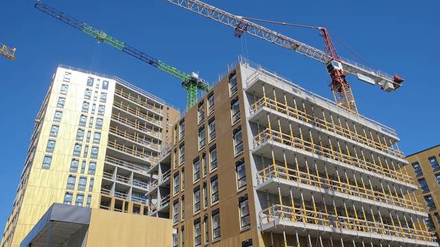 Residential construction site with tower cranes